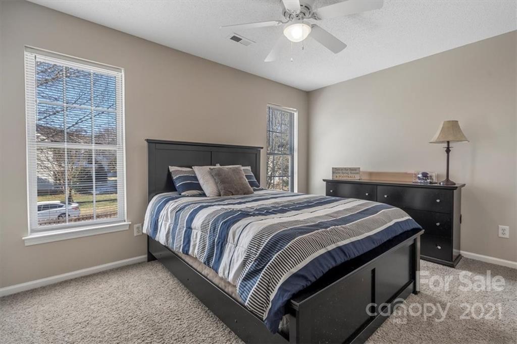 3919 Faith Church Road Indian Trail, NC 28079 - Photo 25 of 34 a bedroom with a bed and window