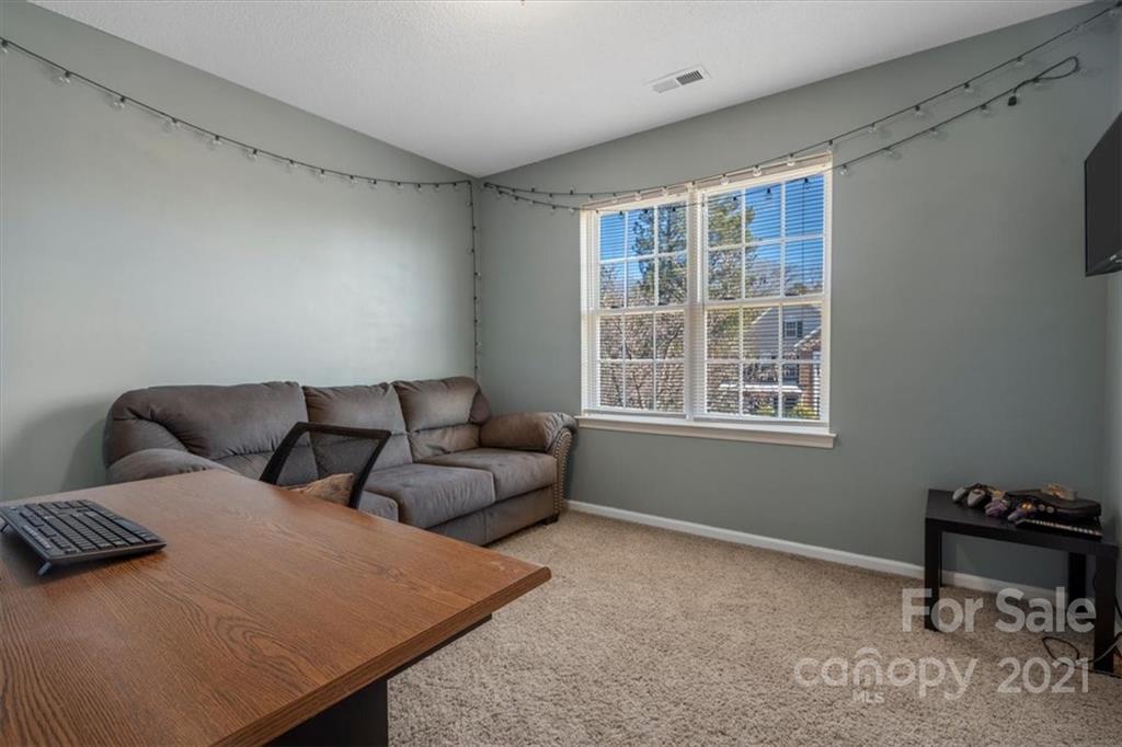 3919 Faith Church Road Indian Trail, NC 28079 - Photo 26 of 34 a living room with furniture and a window