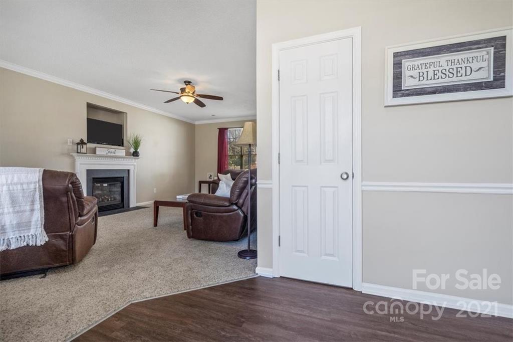 3919 Faith Church Road Indian Trail, NC 28079 - Photo 5 of 34 a living room with furniture and a fireplace