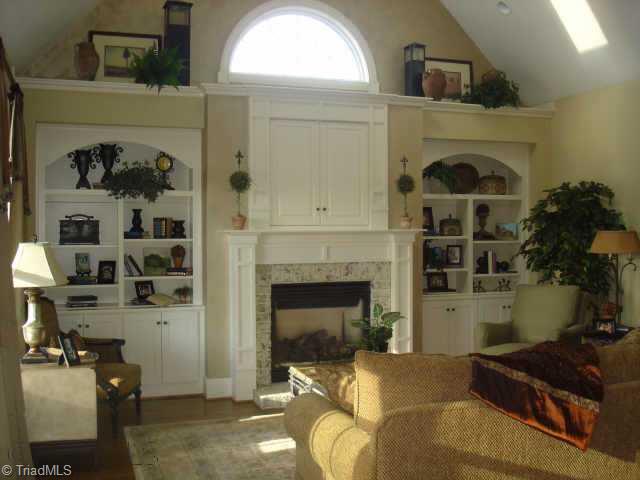 Other. Family Room w/built-ins on either side of painted brick fireplace