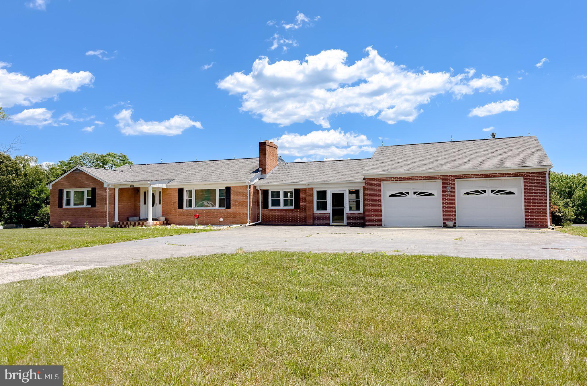 23230 Colton Point Road Avenue, MD 20609 - Photo 2 of 63 Charming brick home under blue skies.