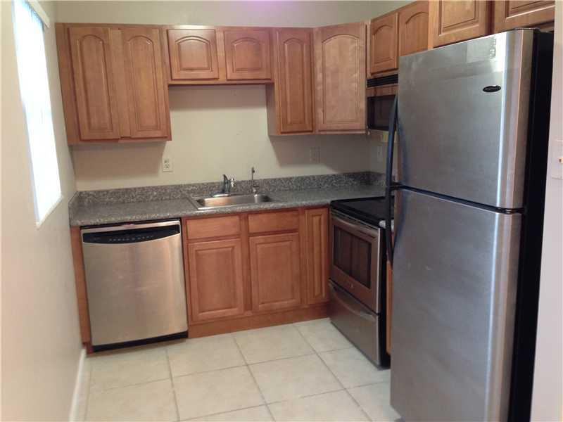 1005 Hythe A, Unit 1005 Boca Raton, FL 33434 - Photo 2 of 4 a kitchen with stainless steel appliances granite countertop a refrigerator sink and cabinets