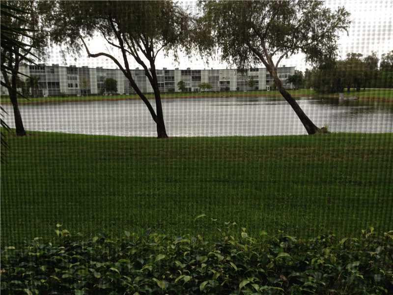 1005 Hythe A, Unit 1005 Boca Raton, FL 33434 - Photo 4 of 4 a view of a tennis court
