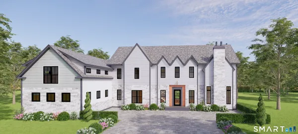 a view of a white house with a yard and plants