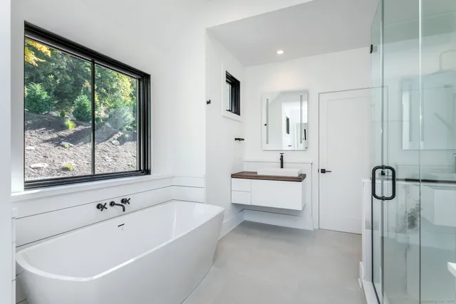 a bathroom with a bathtub and a sink