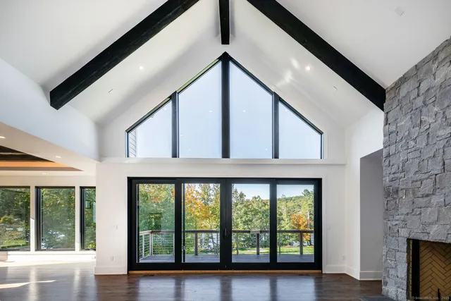 a view of an entryway with wooden floor