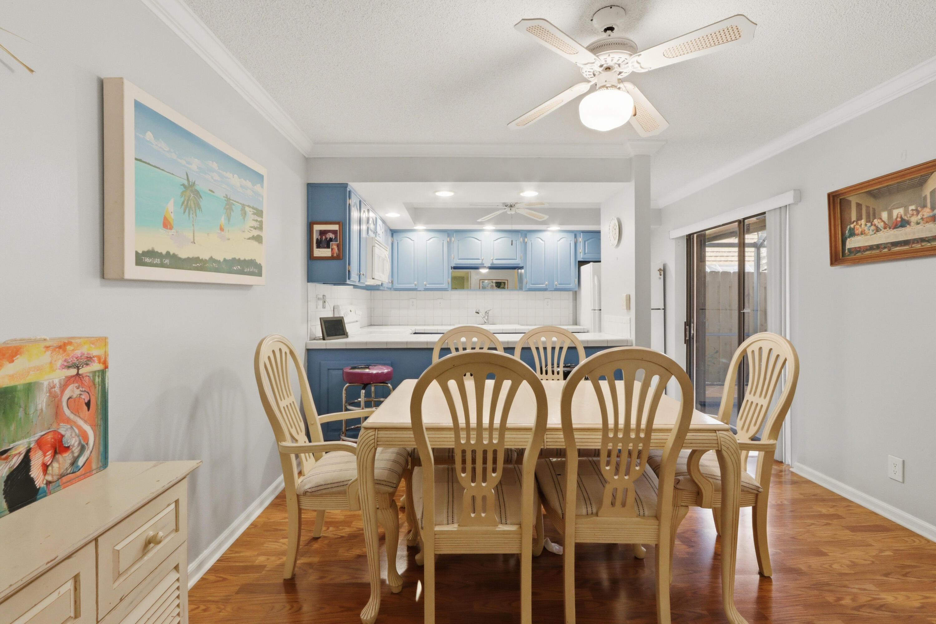 9 Atrium Circle, Unit C Atlantis, FL 33462 - Photo 11 of 54 a view of a dining room with furniture and wooden floor