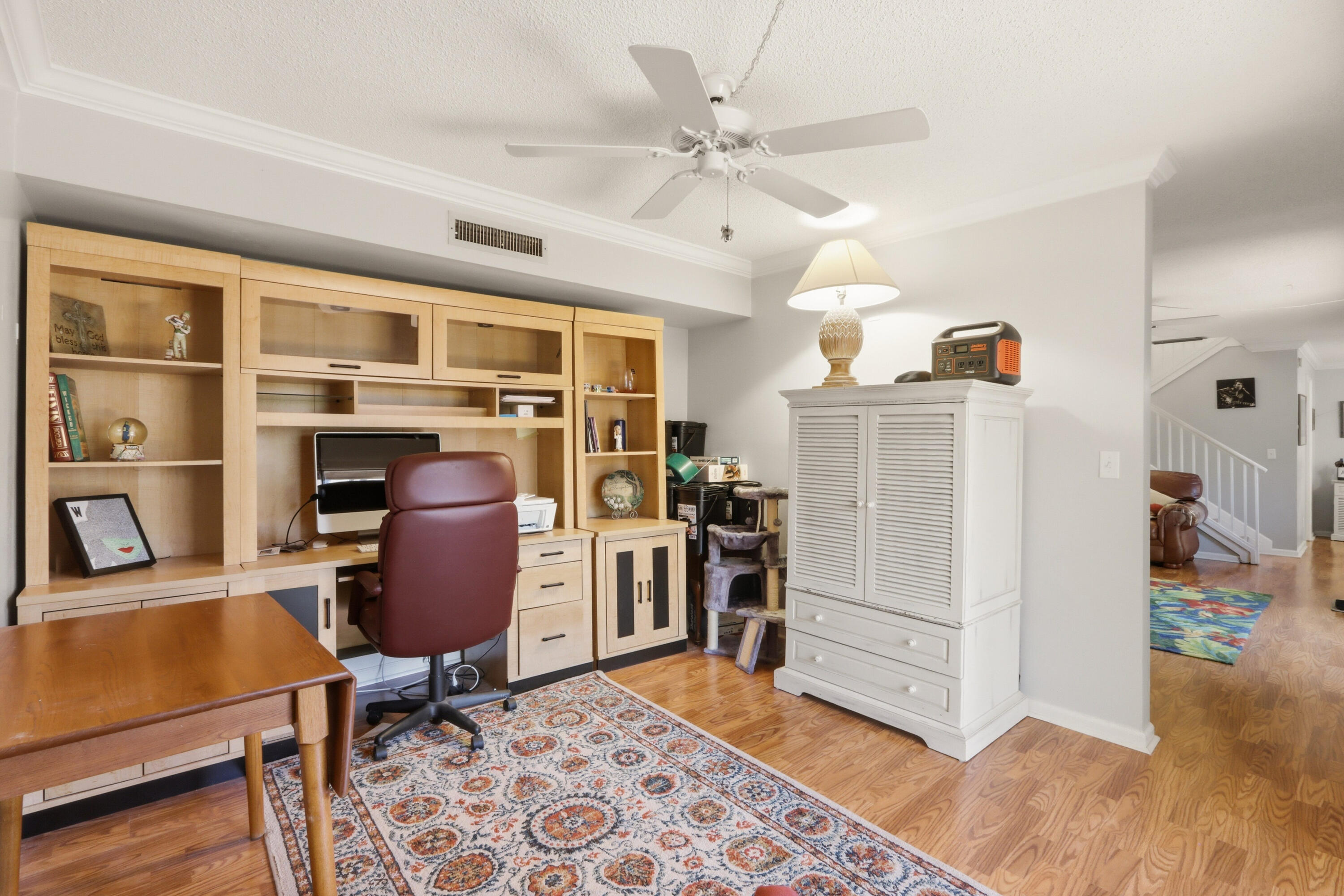 9 Atrium Circle, Unit C Atlantis, FL 33462 - Photo 18 of 54 a view of a workspace with furniture and a window