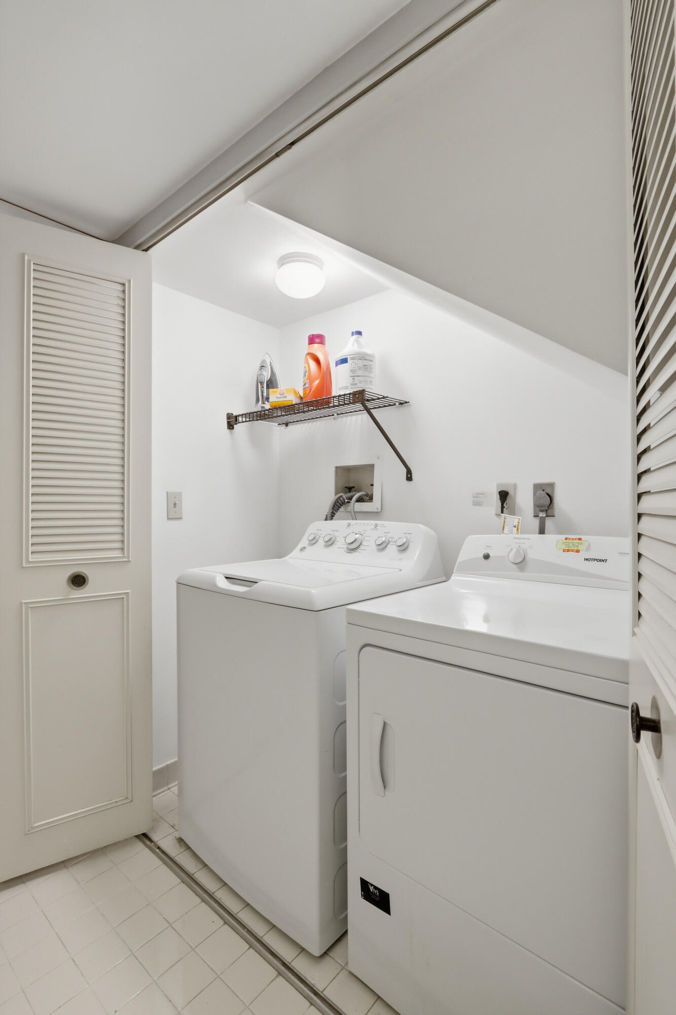 9 Atrium Circle, Unit C Atlantis, FL 33462 - Photo 20 of 54 a utility room with dryer and washer