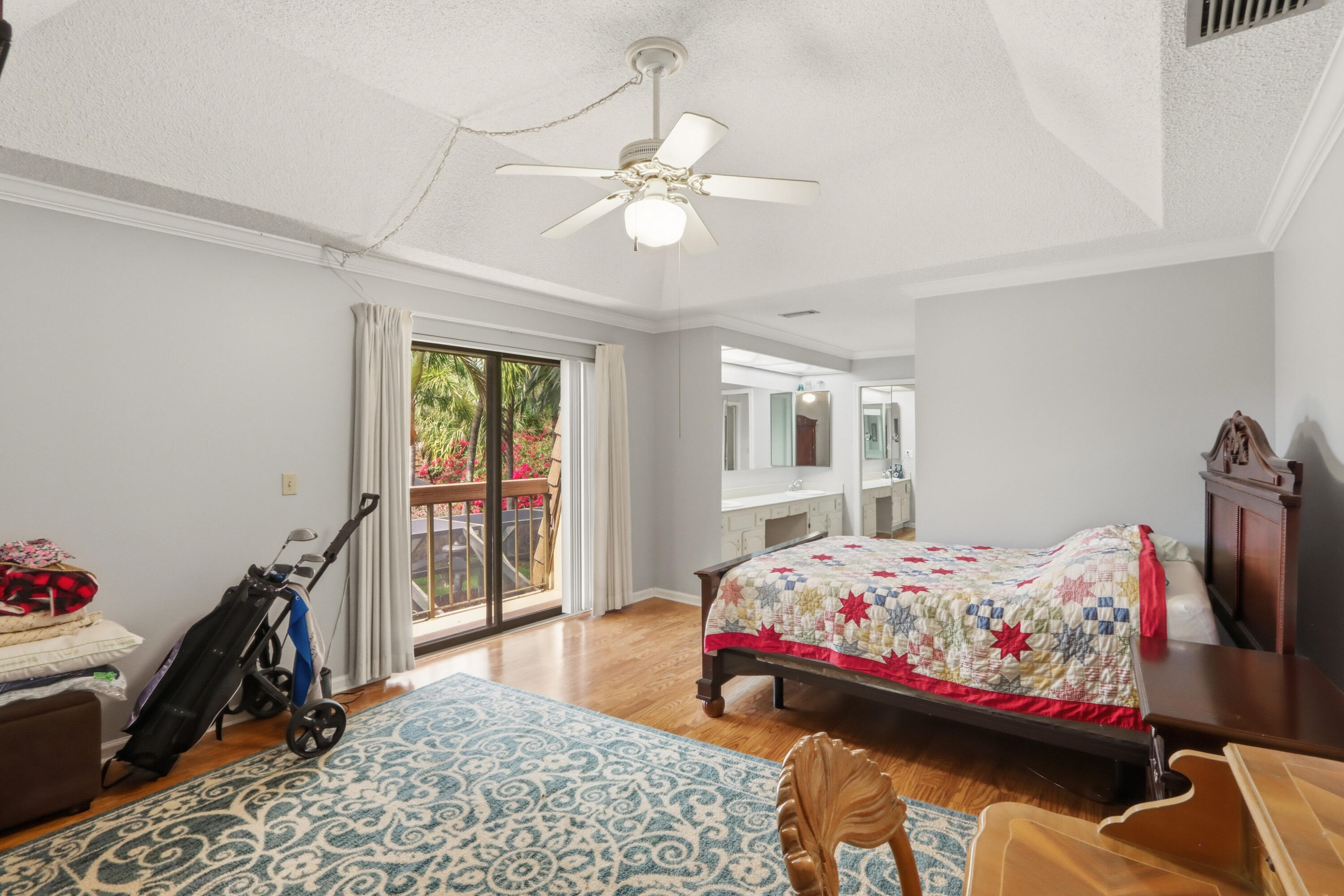 9 Atrium Circle, Unit C Atlantis, FL 33462 - Photo 22 of 54 a bedroom with bed and a window