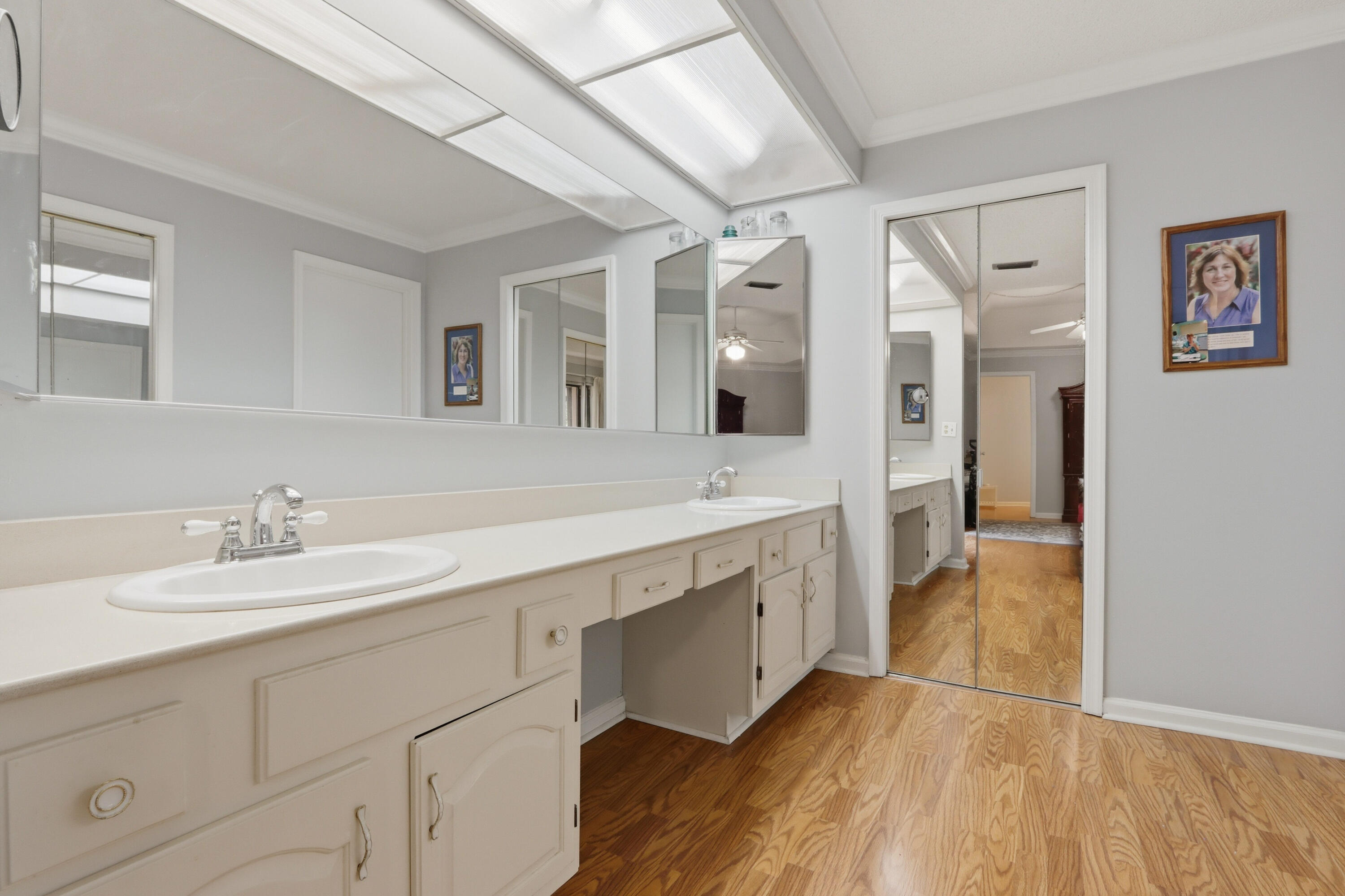9 Atrium Circle, Unit C Atlantis, FL 33462 - Photo 24 of 54 a spacious bathroom with a double vanity sink and a mirror