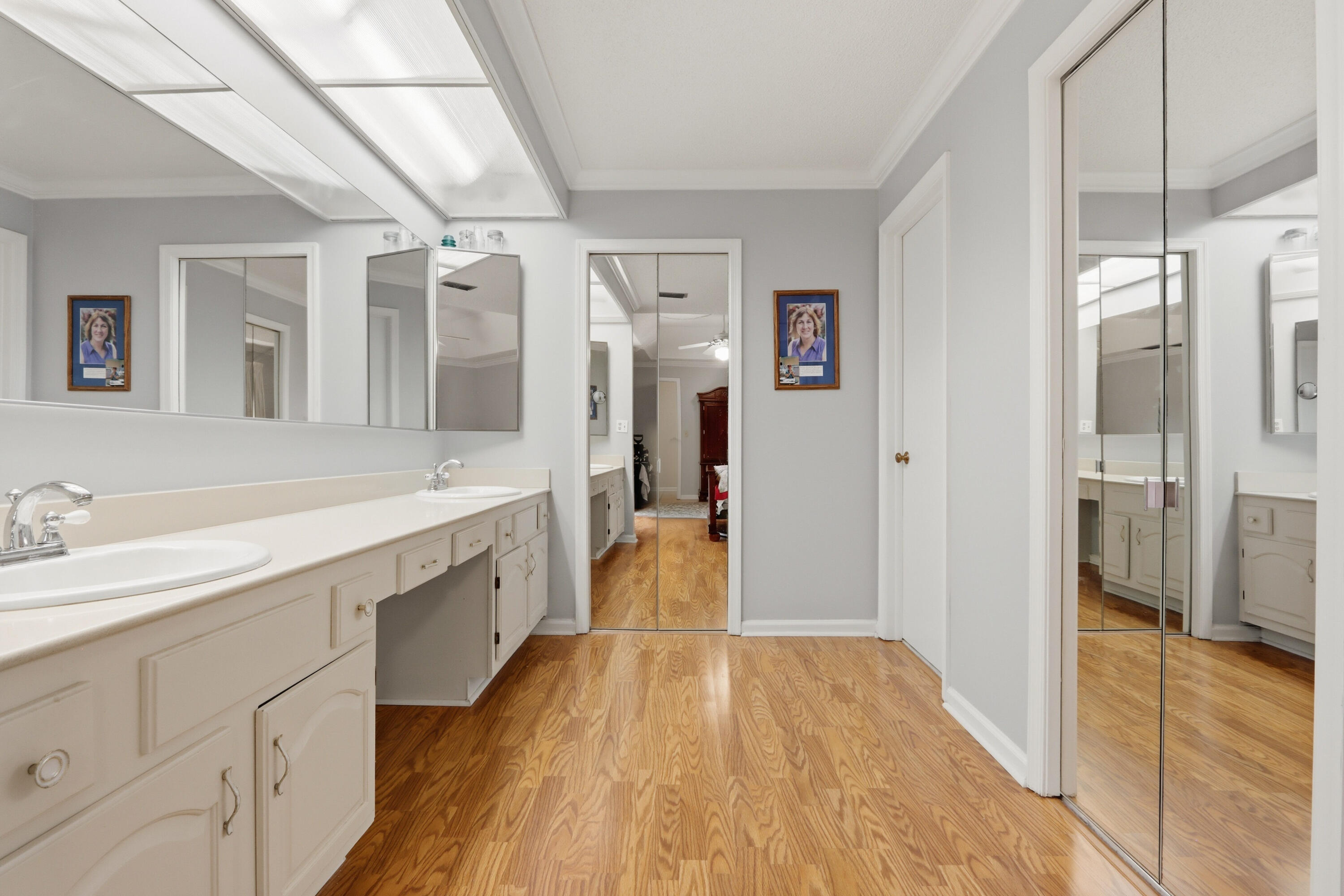 9 Atrium Circle, Unit C Atlantis, FL 33462 - Photo 25 of 54 a spacious bathroom with a granite countertop sink mirror and a shower