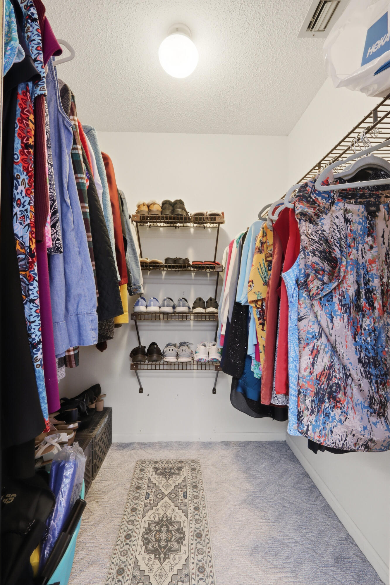 9 Atrium Circle, Unit C Atlantis, FL 33462 - Photo 26 of 54 a view of walk in closet with clothes and shoes