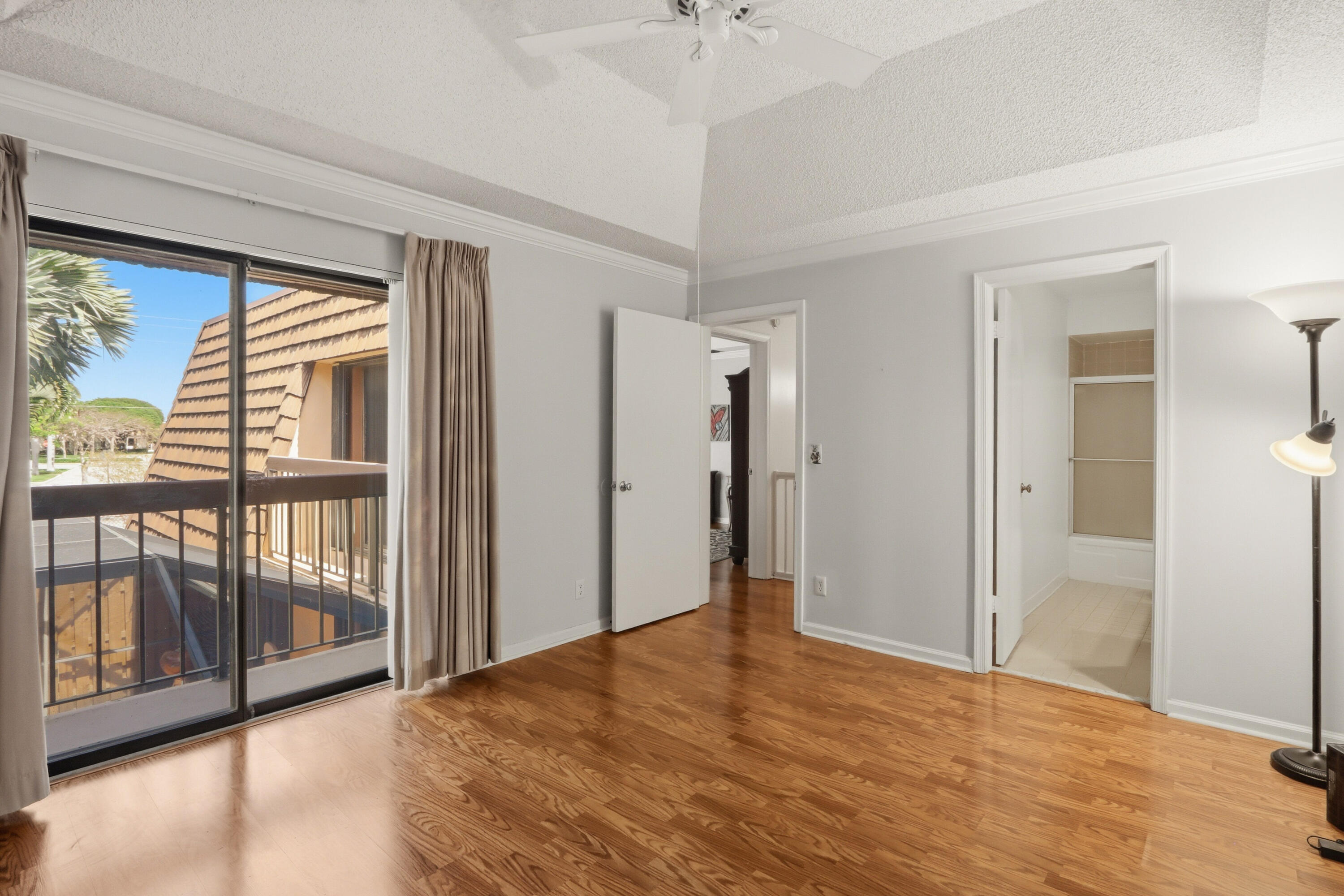 9 Atrium Circle, Unit C Atlantis, FL 33462 - Photo 28 of 54 a view of empty room with floor to ceiling window