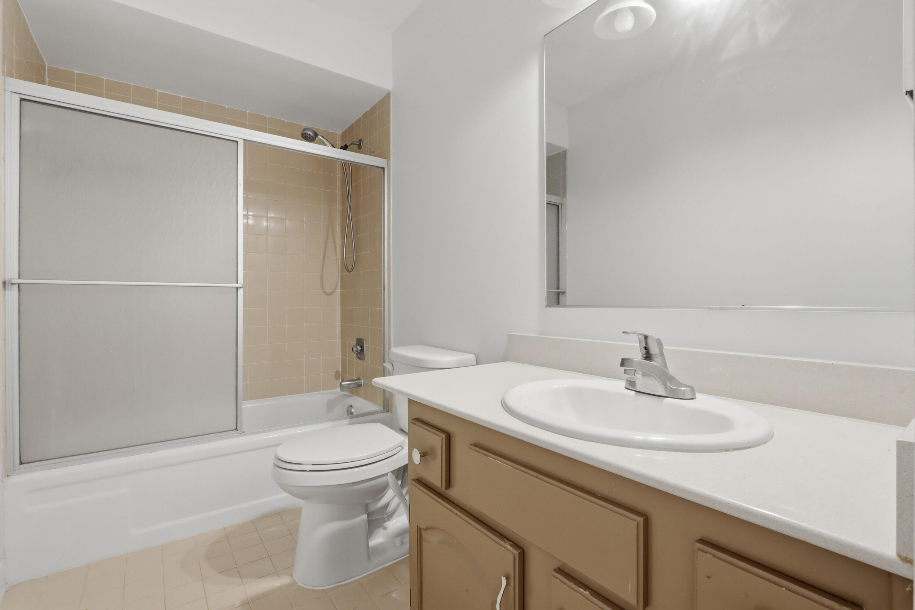 9 Atrium Circle, Unit C Atlantis, FL 33462 - Photo 29 of 54 a bathroom with a sink toilet and shower