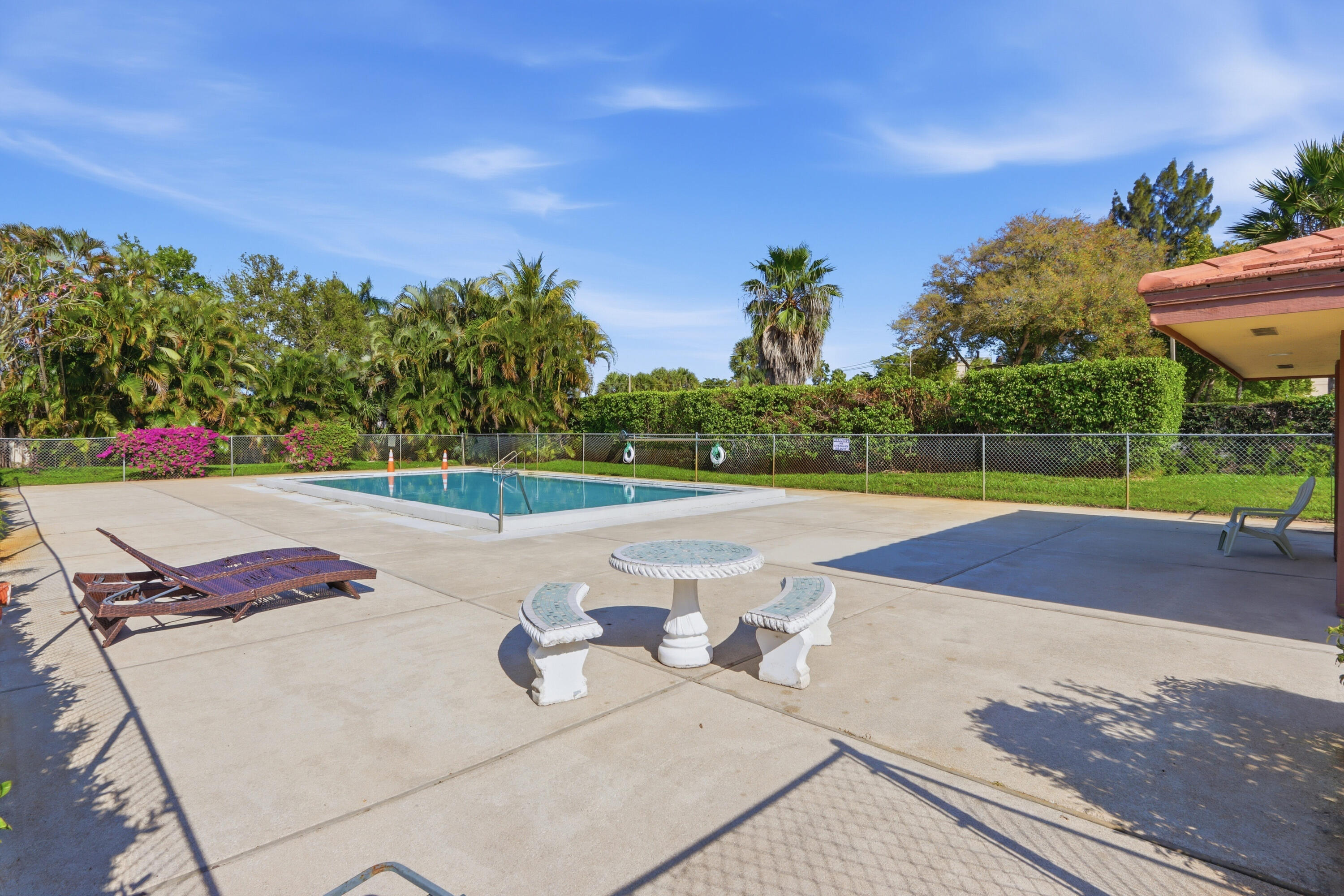 9 Atrium Circle, Unit C Atlantis, FL 33462 - Photo 34 of 54 a view of a yard with an outdoor space