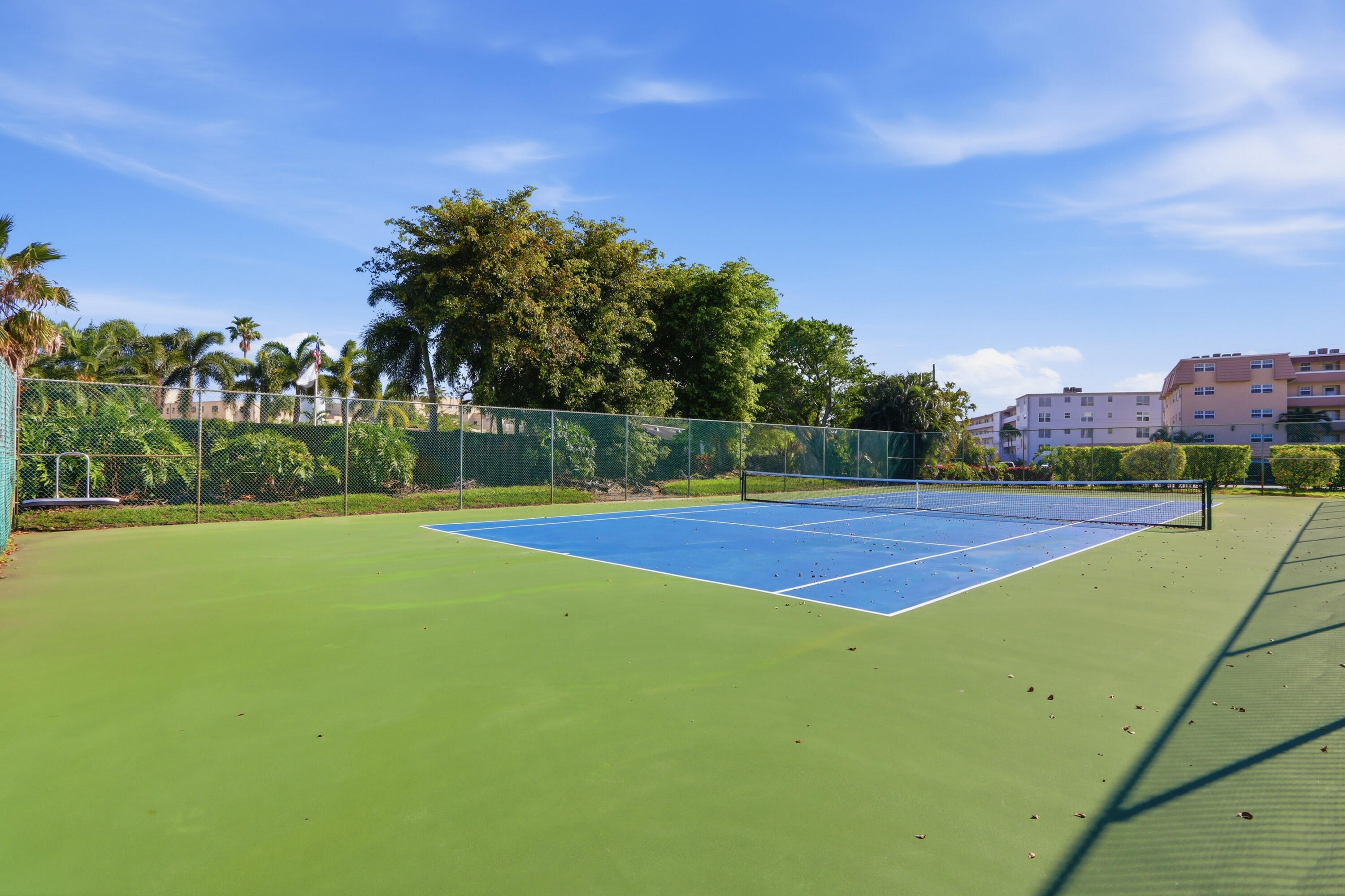 9 Atrium Circle, Unit C Atlantis, FL 33462 - Photo 35 of 54 a view of a tennis court