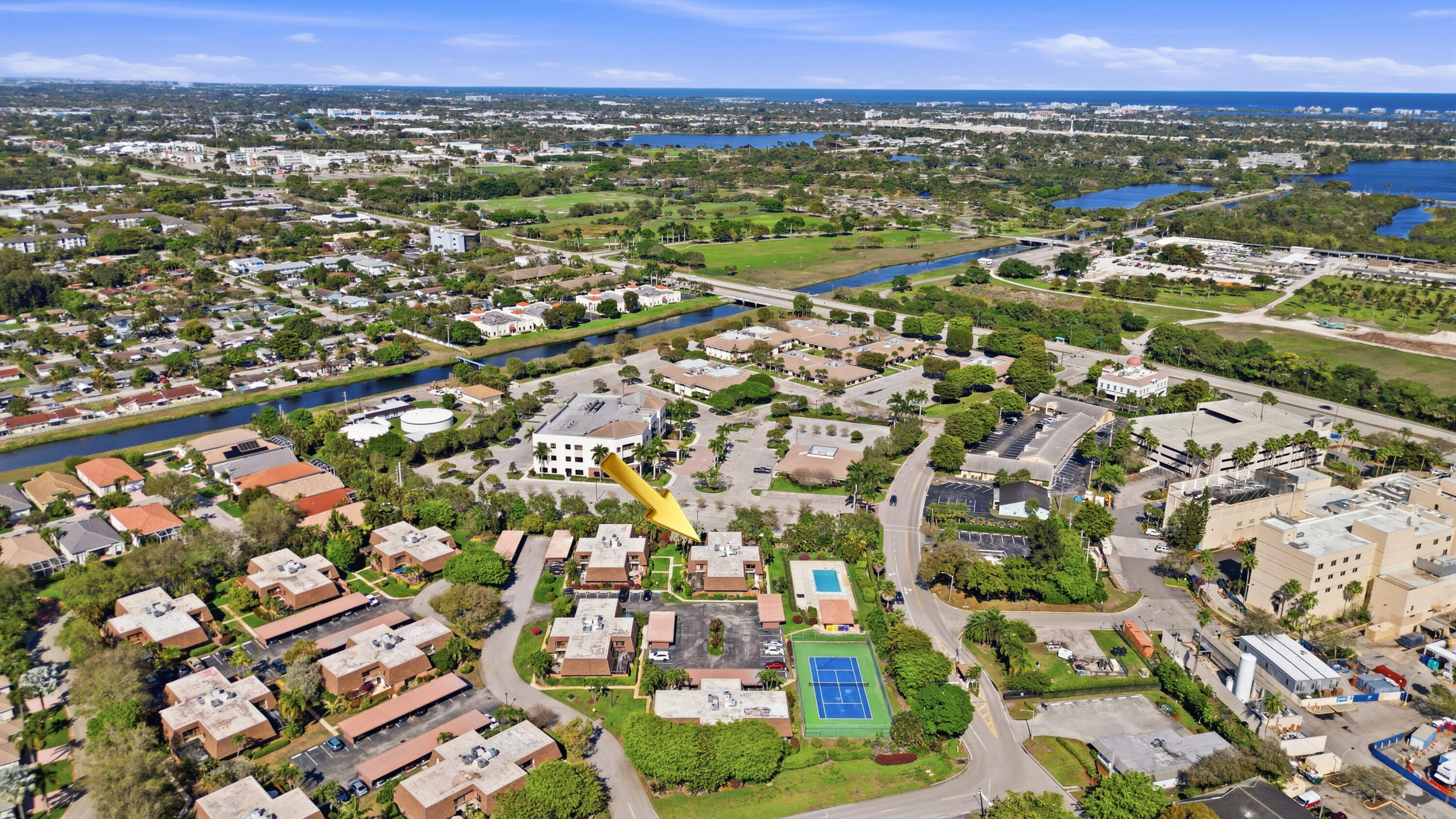 9 Atrium Circle, Unit C Atlantis, FL 33462 - Photo 42 of 54 an aerial view of residential houses with outdoor space