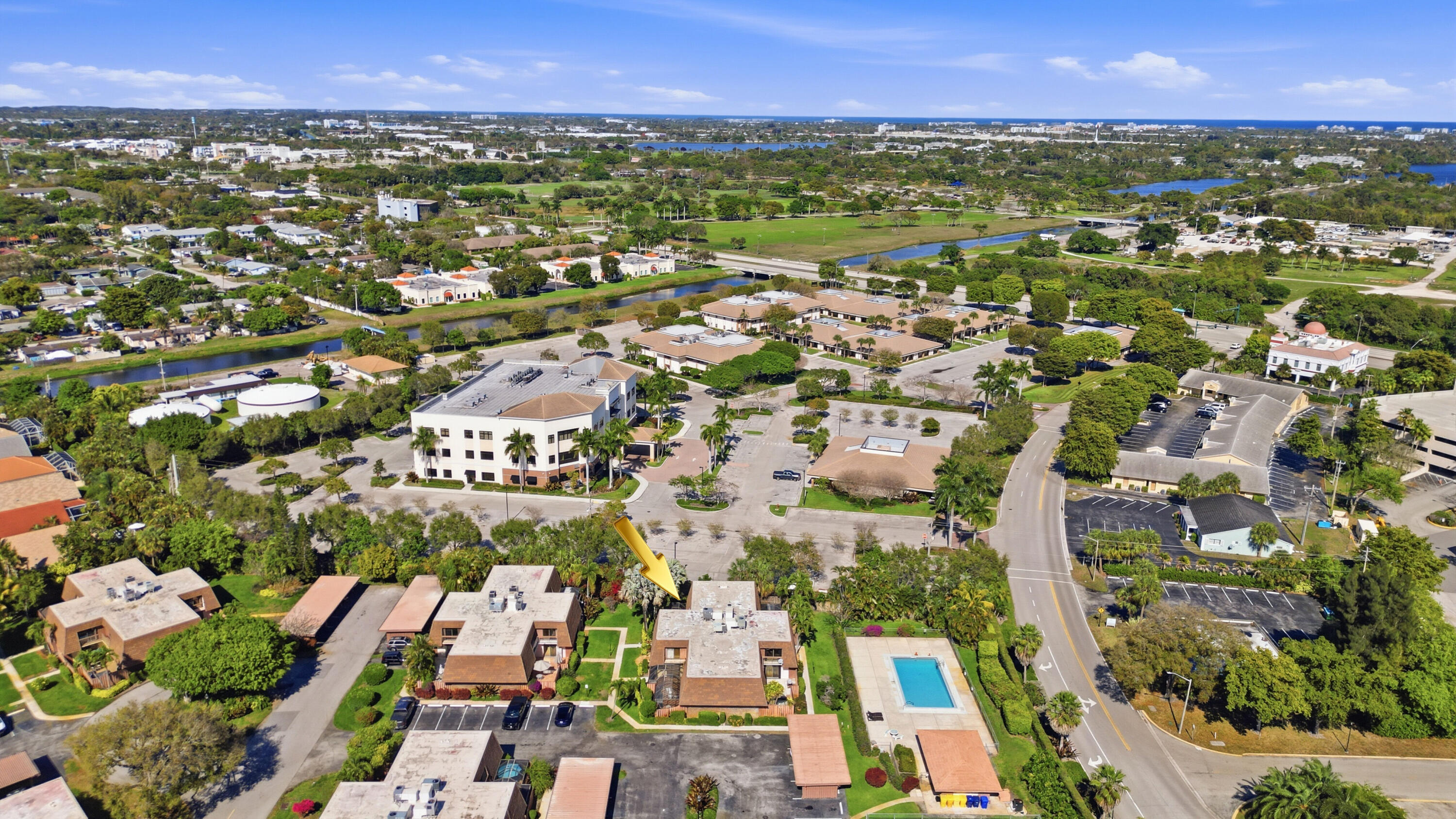 9 Atrium Circle, Unit C Atlantis, FL 33462 - Photo 44 of 54 an aerial view of residential houses with outdoor space
