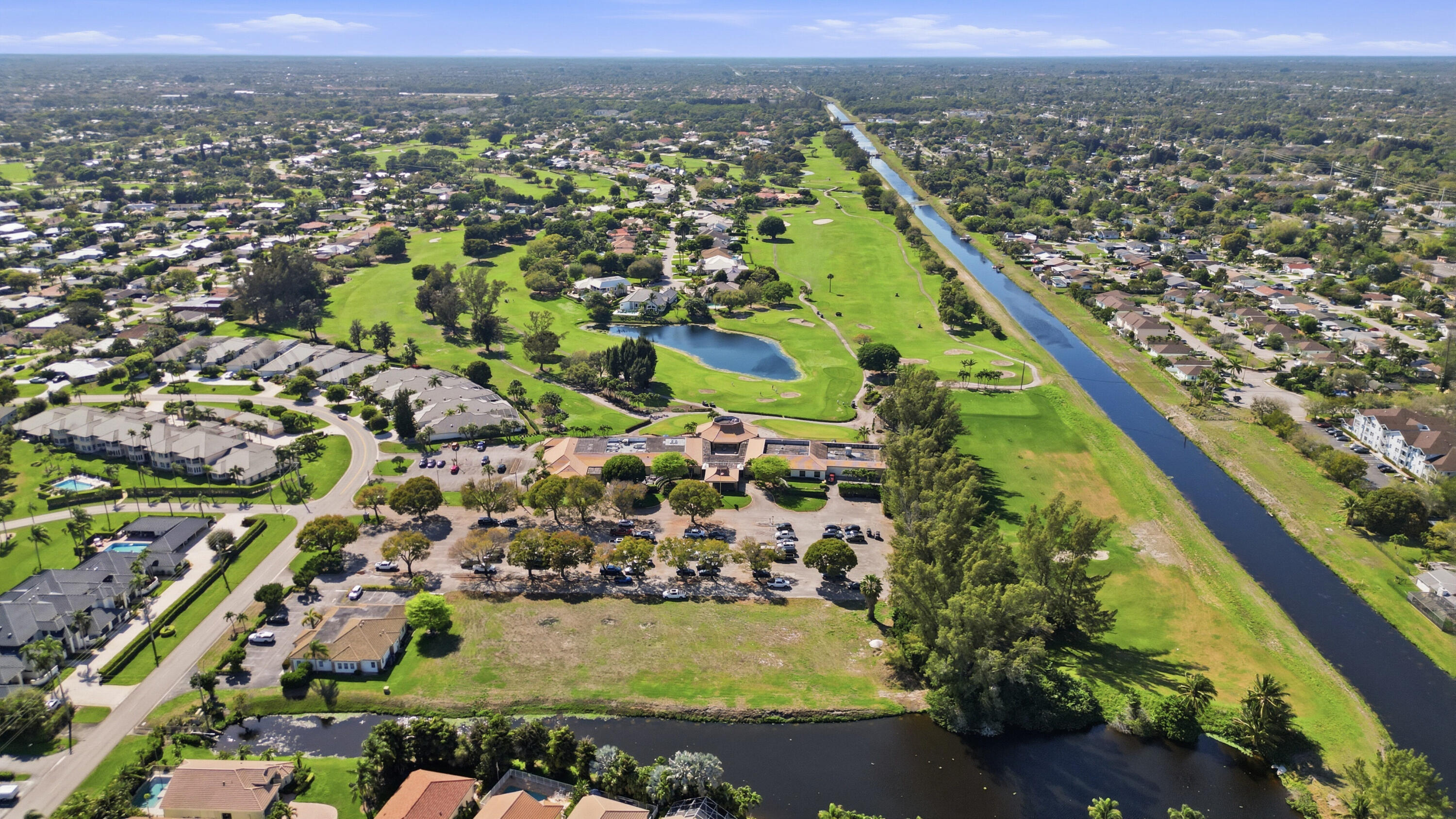9 Atrium Circle, Unit C Atlantis, FL 33462 - Photo 45 of 54 an aerial view of residential houses with outdoor space