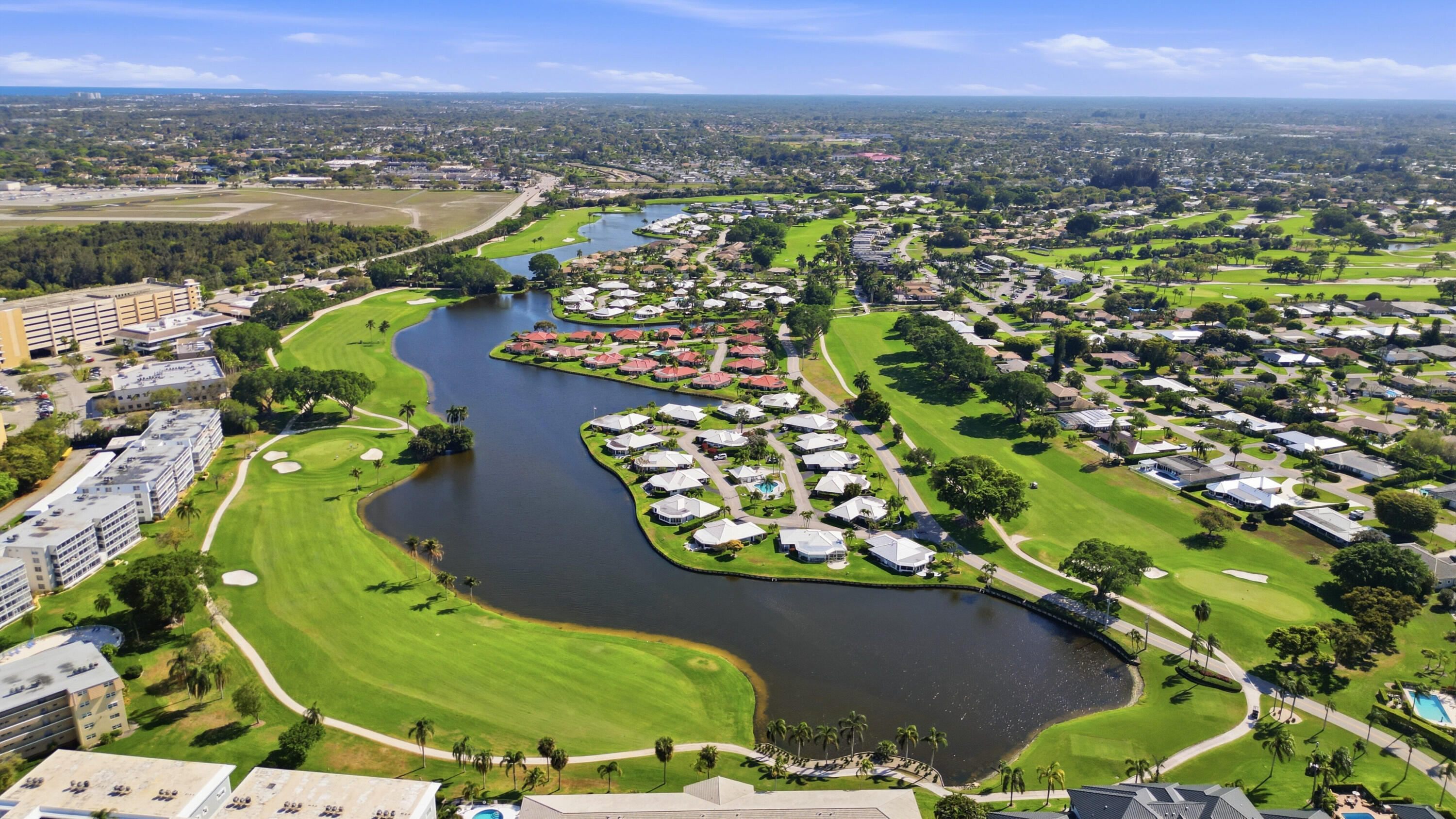 9 Atrium Circle, Unit C Atlantis, FL 33462 - Photo 47 of 54 an aerial view of a residential houses with outdoor space and river