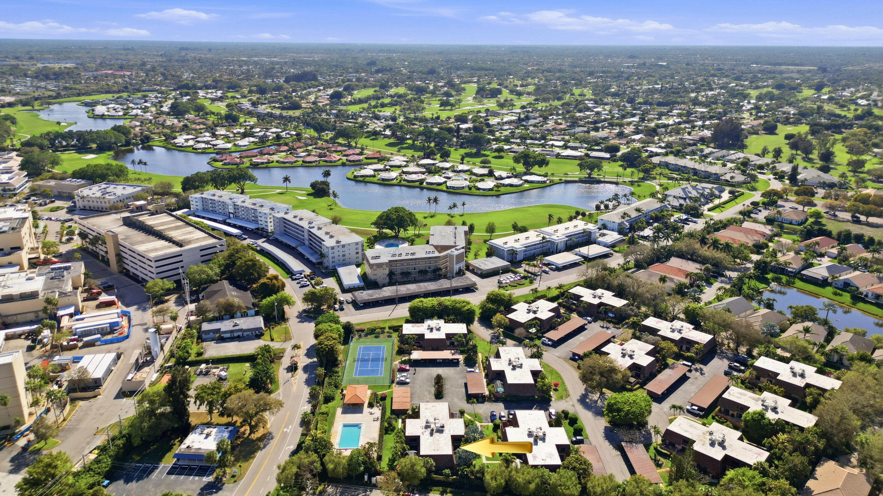 9 Atrium Circle, Unit C Atlantis, FL 33462 - Photo 50 of 54 an aerial view of residential houses with outdoor space