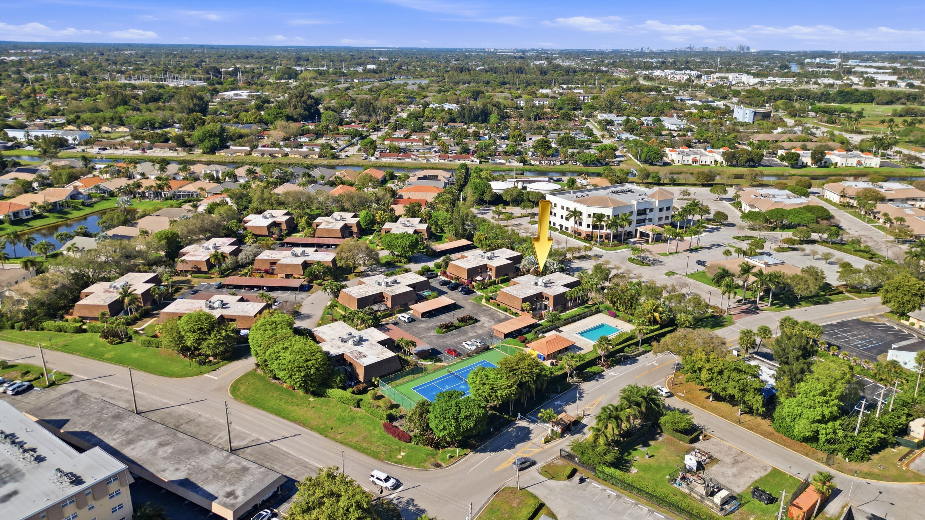 9 Atrium Circle, Unit C Atlantis, FL 33462 - Photo 53 of 54 an aerial view of residential houses with outdoor space and trees
