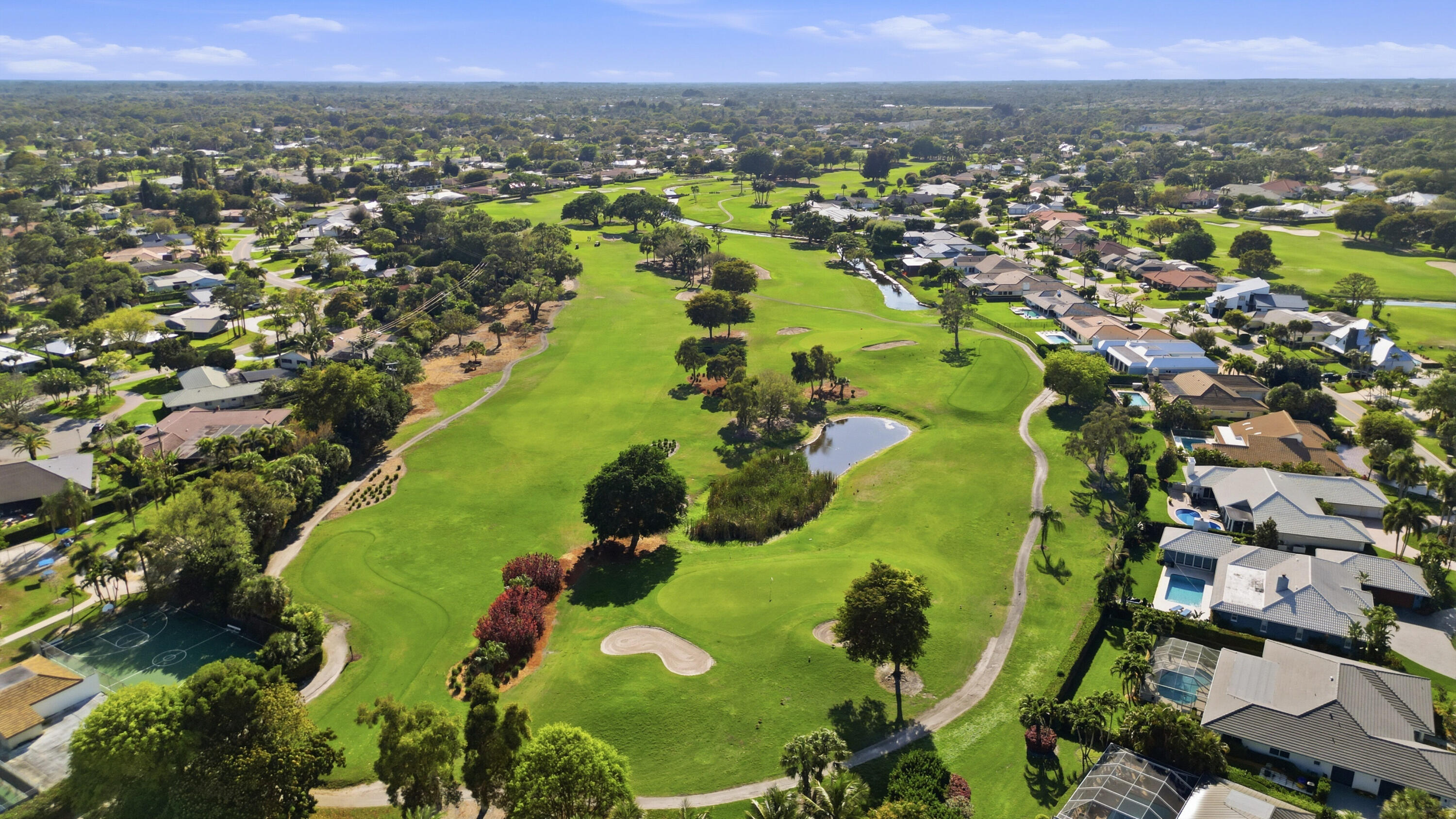 9 Atrium Circle, Unit C Atlantis, FL 33462 - Photo 54 of 54 an aerial view of a residential houses with outdoor space and swimming pool