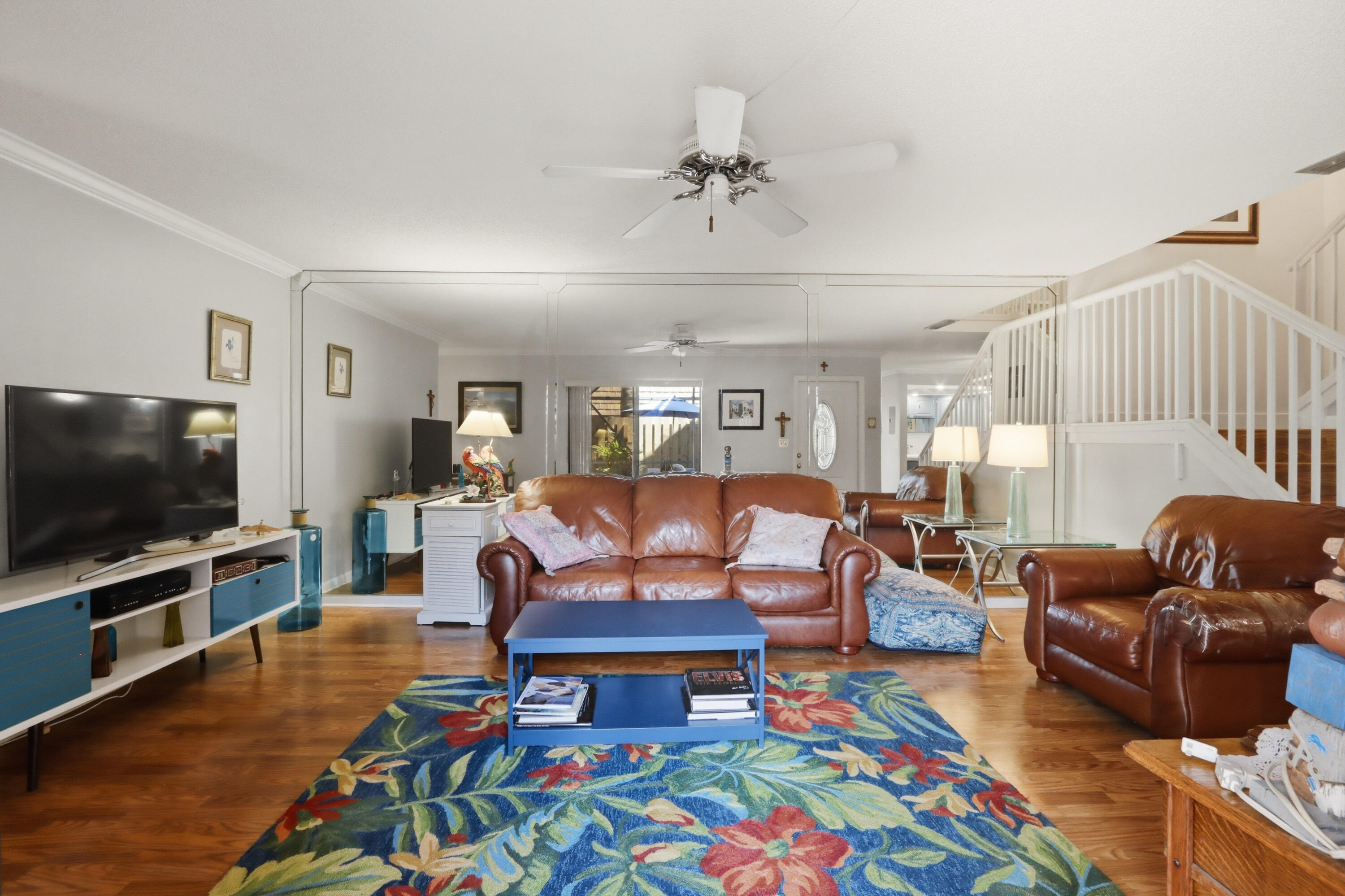 9 Atrium Circle, Unit C Atlantis, FL 33462 - Photo 6 of 54 a living room with furniture and a flat screen tv