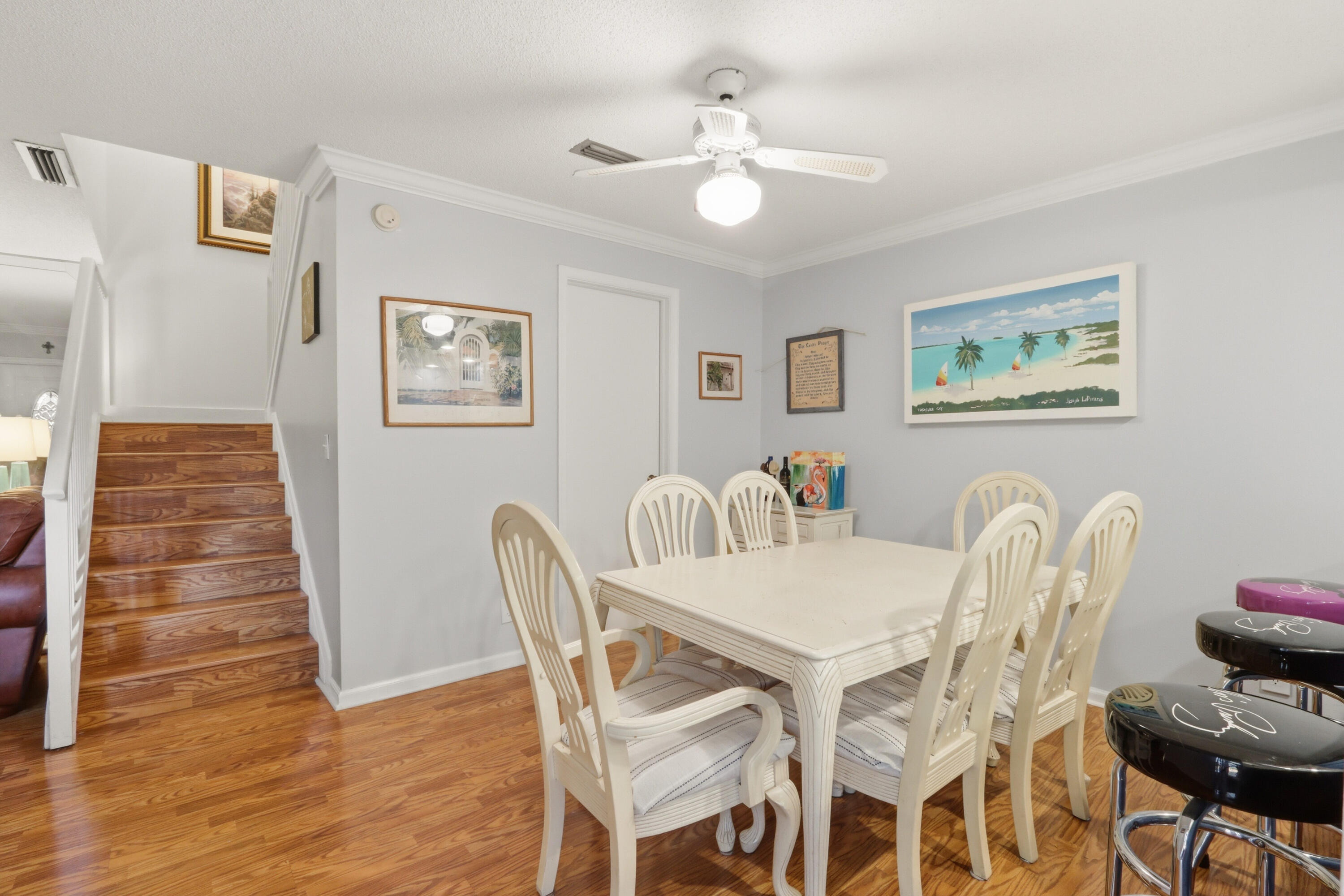 9 Atrium Circle, Unit C Atlantis, FL 33462 - Photo 10 of 54 a view of a dining room with furniture and wooden floor
