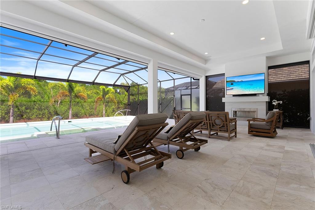 8829 Paradera Court Naples, FL 34112 - Photo 20 of 31 a view of a room with gym equipment