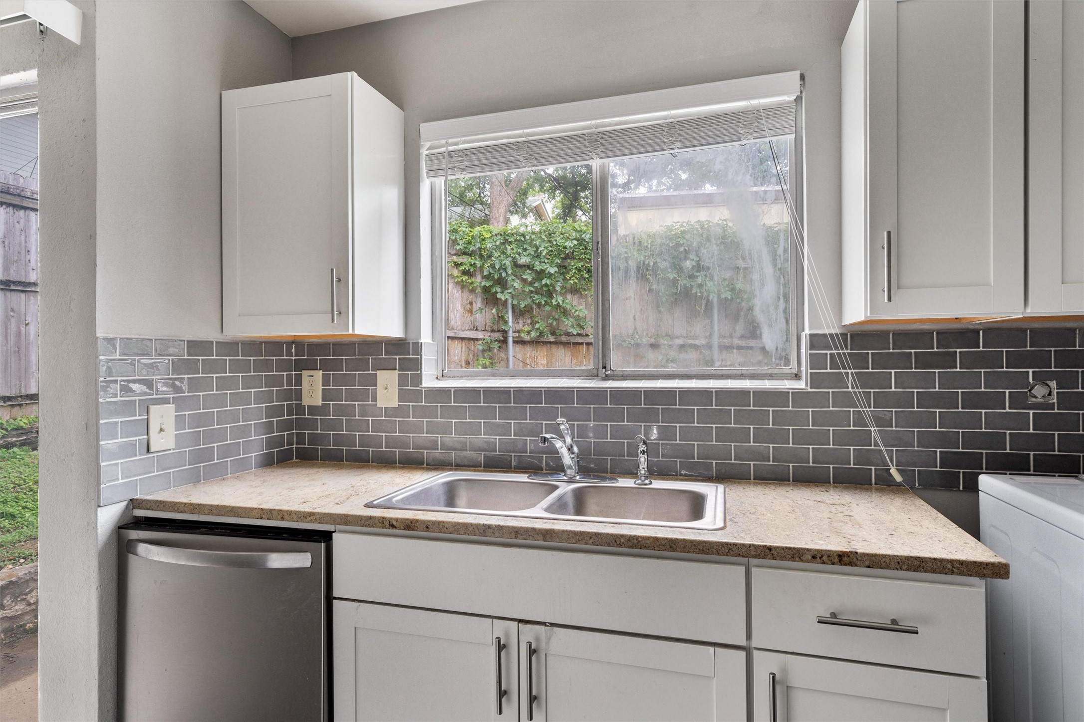 3415 Menchaca Road, Unit 113 Austin, TX 78704 - Photo 7 of 21 a bathroom with a sink and a window