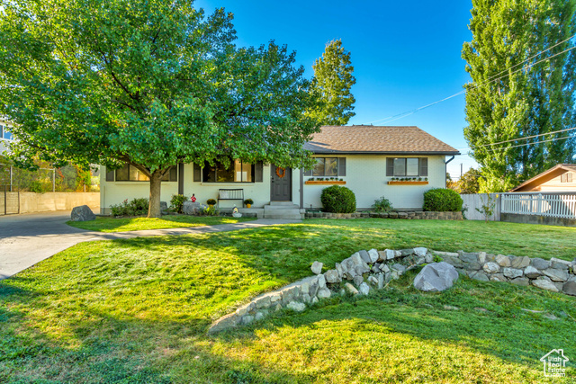 360 East Center Street Centerville, UT 84014 - Photo 2 of 41 View of front of home featuring a shingled roof and concrete driveway