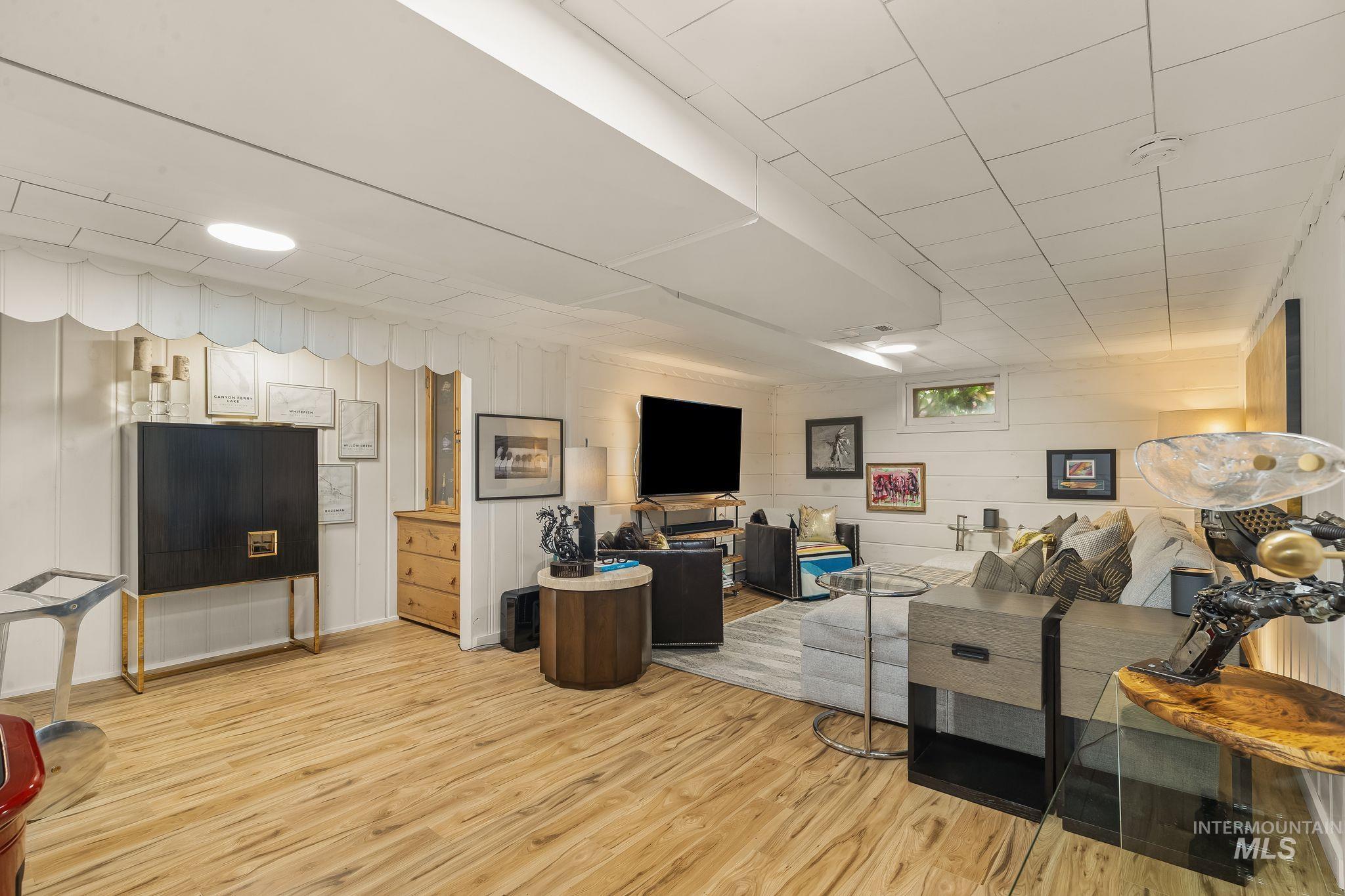 1315 8th Street Clarkston, WA 99403 - Photo 24 of 37 Spacious recreation area featuring wood-finish flooring and white plank walls