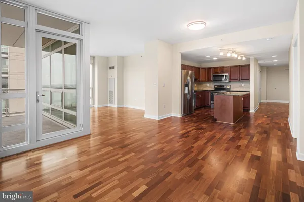 a view of a kitchen with a sink and cabinets