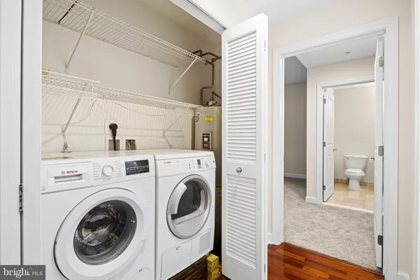 a view of a hallway with washer and dryer