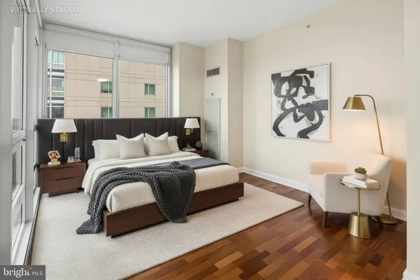 a bedroom with a bed and a chair