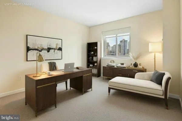 a living room with furniture and a table