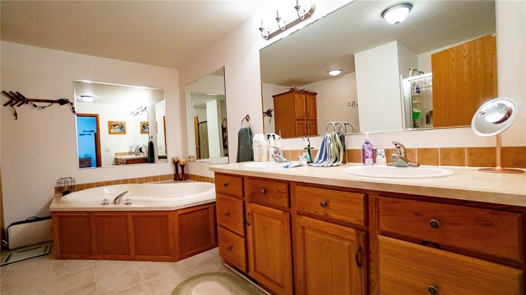 201 Youkers Road Butler, PA 16001 - Photo 11 of 25 a spacious bathroom with a tub sink and mirror