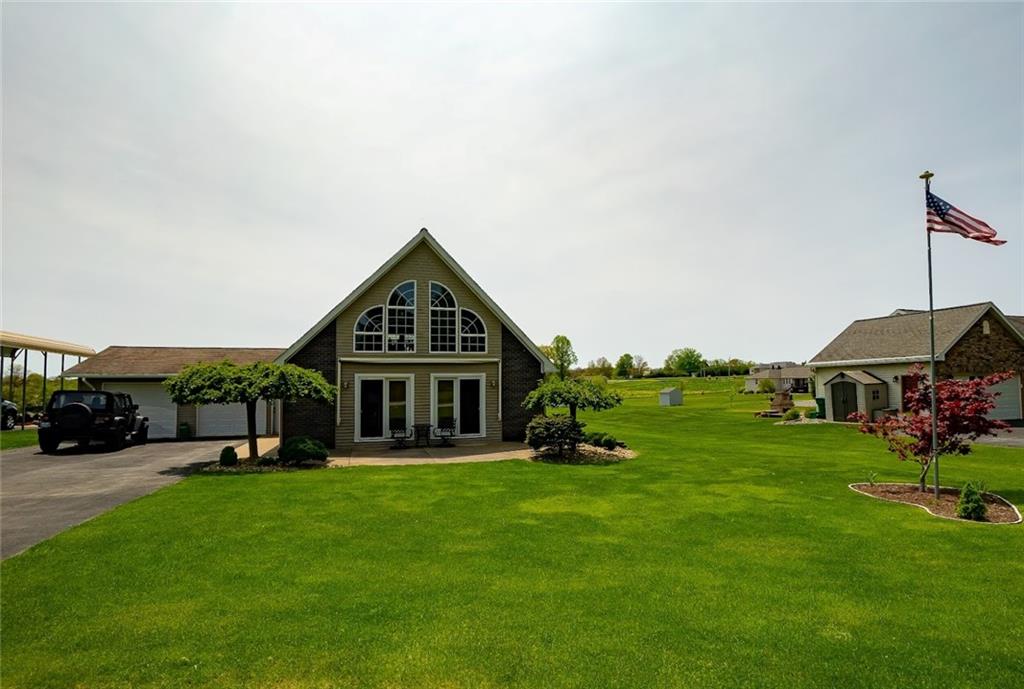 201 Youkers Road Butler, PA 16001 - Photo 24 of 25 a front view of a house with a yard table and chairs