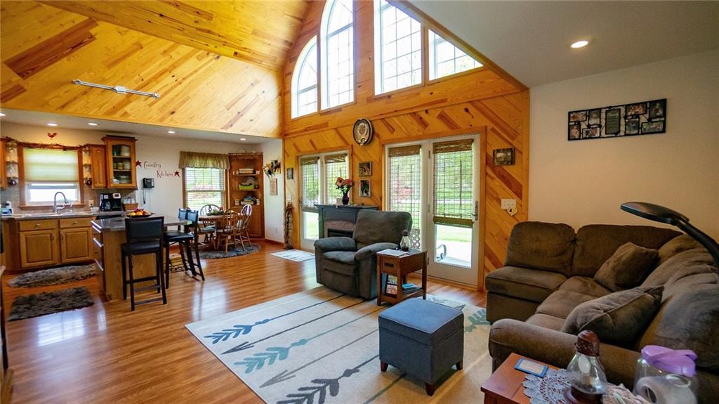 201 Youkers Road Butler, PA 16001 - Photo 3 of 25 a living room with furniture a wooden floor and a chandelier