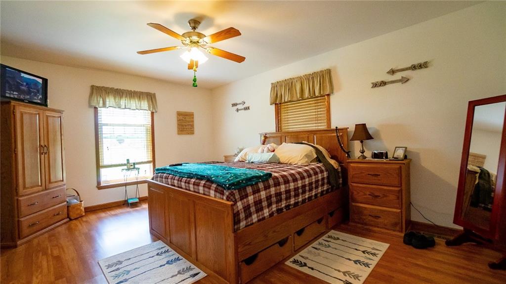 201 Youkers Road Butler, PA 16001 - Photo 10 of 25 a bedroom with a bed and wooden floor