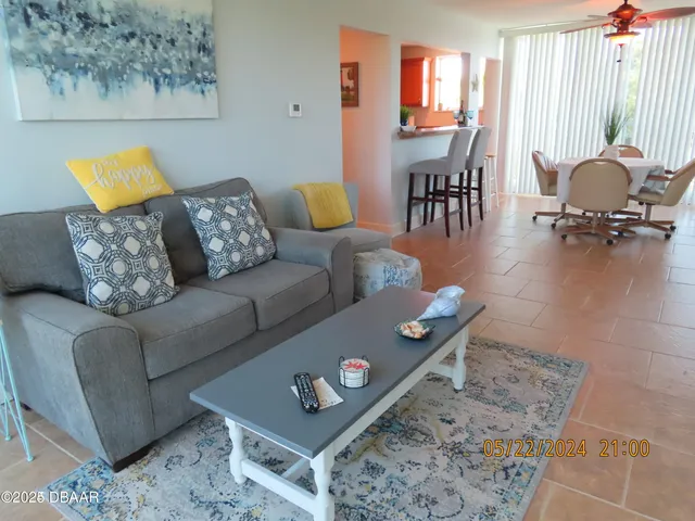 a living room with furniture and a table