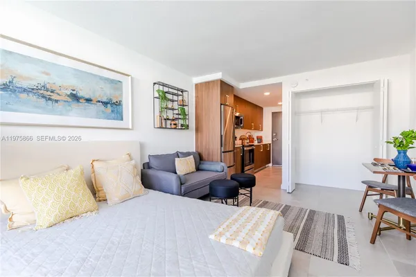 a bedroom with furniture and a couch