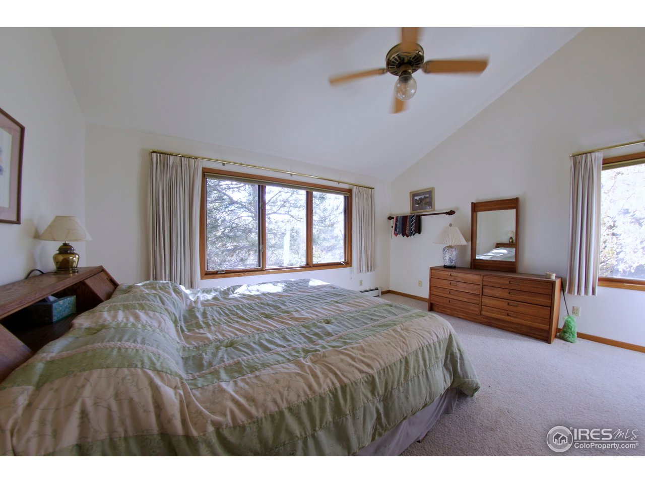 6220 Old Brompton Road Boulder, CO 80301 - Photo 12 of 25 a bedroom with a bed and window