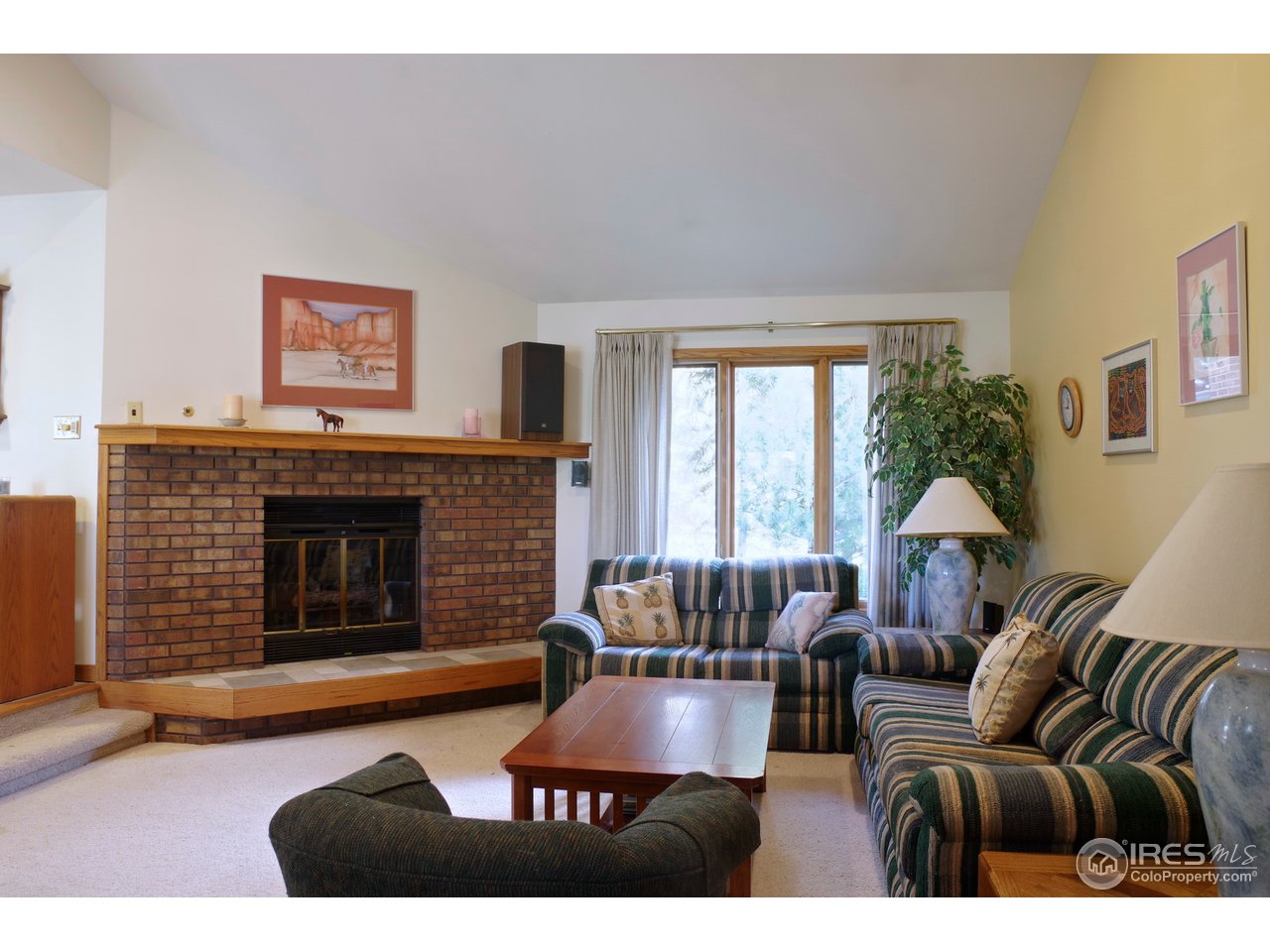 6220 Old Brompton Road Boulder, CO 80301 - Photo 8 of 25 a living room with furniture and a fireplace