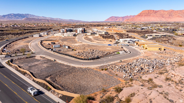 2761 West Lava Hls Road Santa Clara, UT 84765 - Photo 31 of 53 Aerial view of residential area with a mountain backdrop and a desert landscape