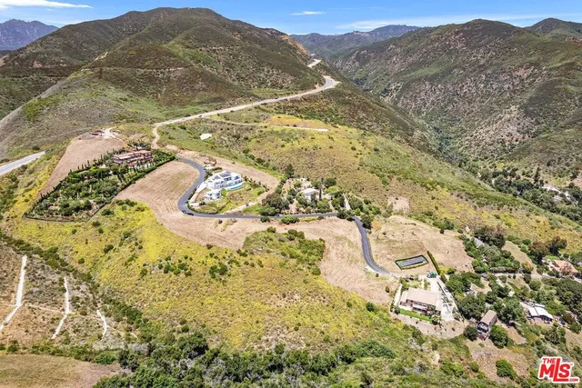a view of an ocean and mountain