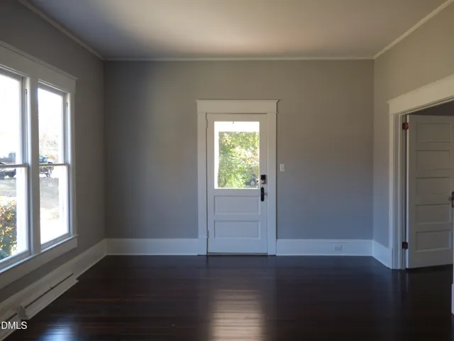 a front view of a house with trees