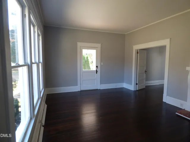 an aerial view of a house with backyard water fountain and sitting area